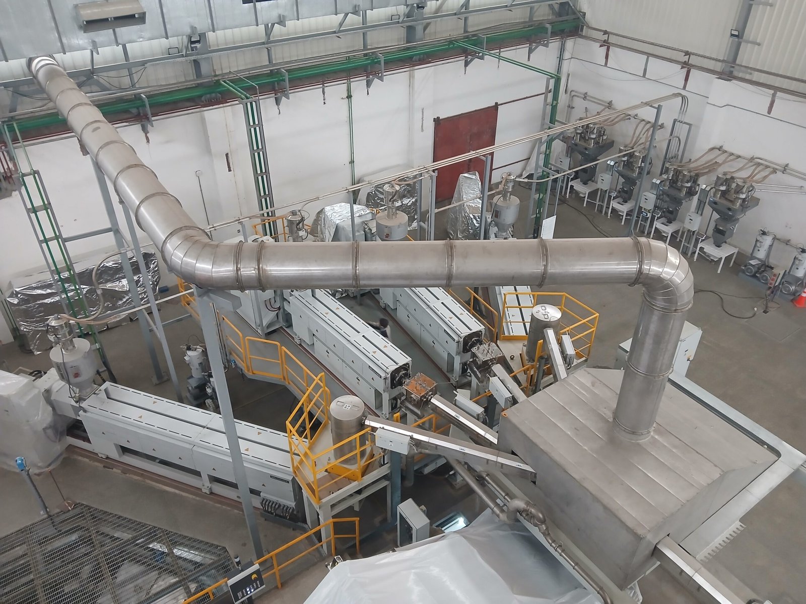 Insulated thermal oil and utility piping over BOPP extrusion line at Poly Pack
