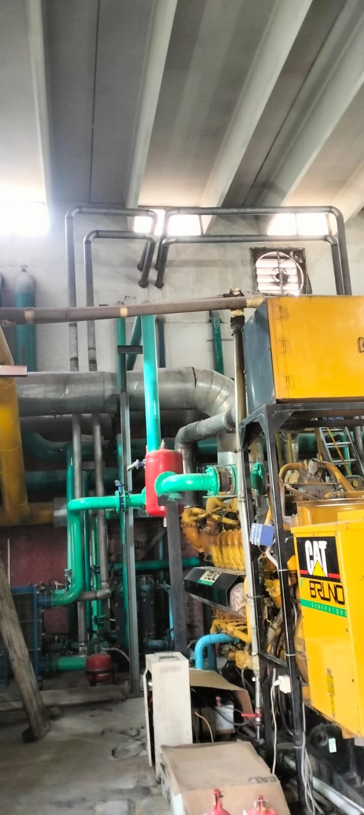 Generator heat recovery hot water piping system at Sarena Textile Industries
