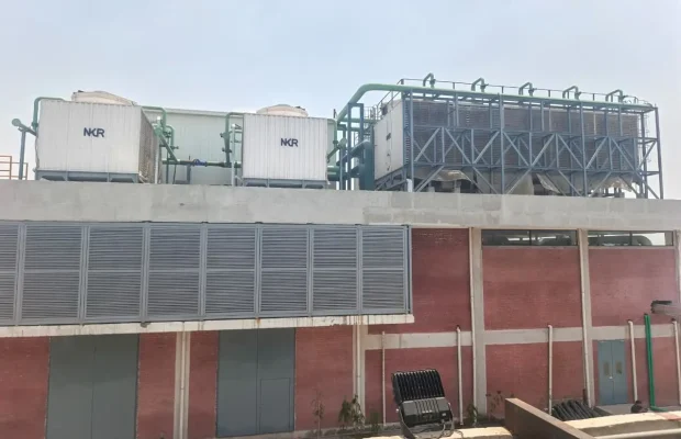 Industrial cooling tower installation with piping and pump station Pakistan MHN Engineering